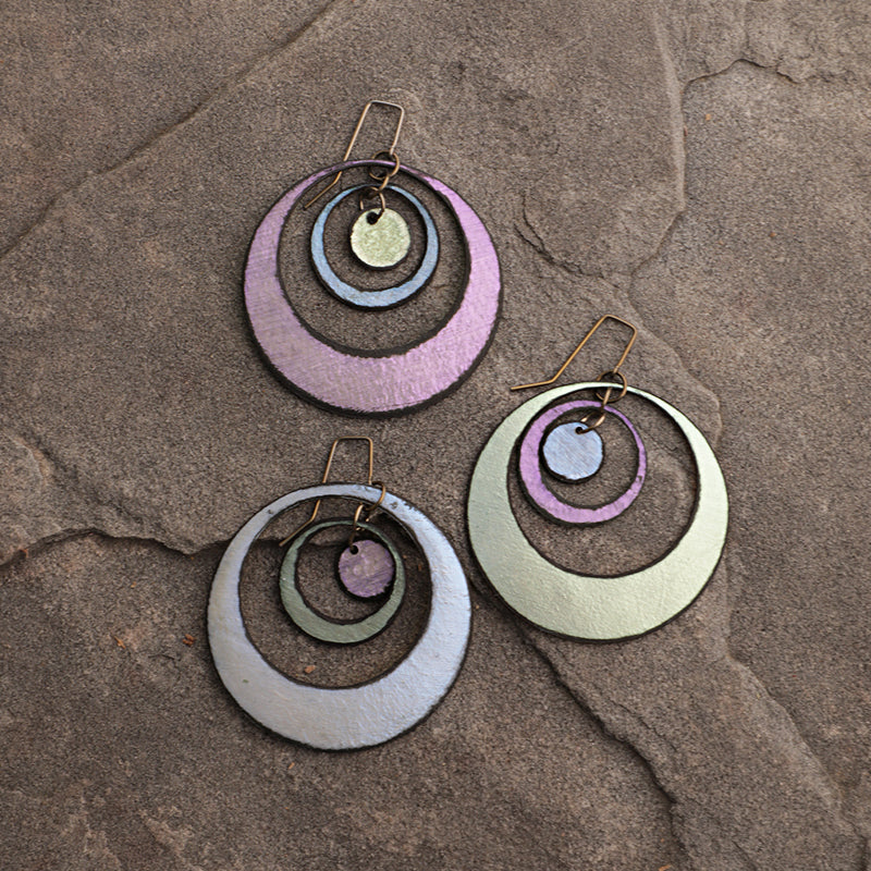 lightweight hypoallergenic circle geometric metallic painted rawhide dangle earrings, handmade in Wyoming