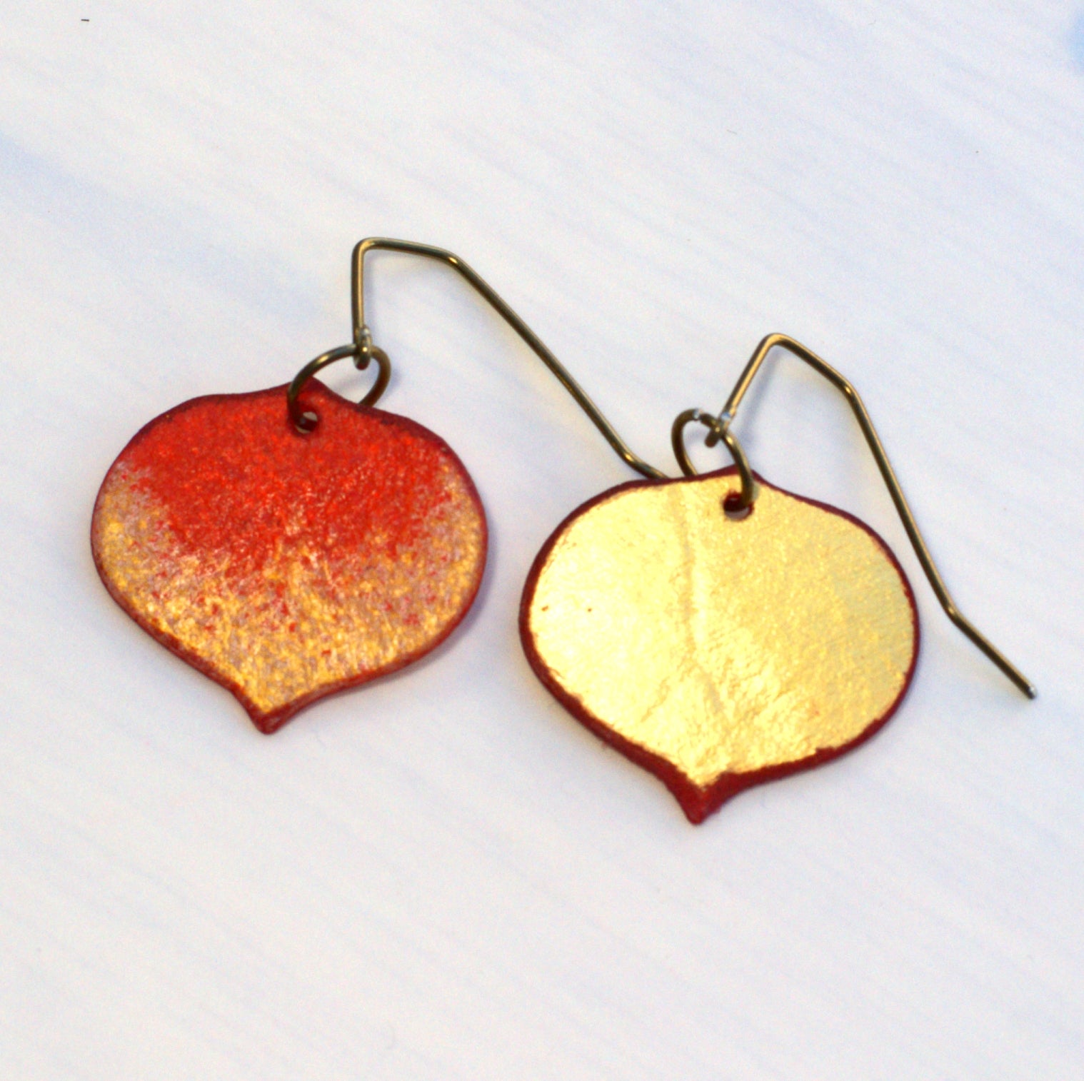 Front and back of small red Aspen leaf earrings 