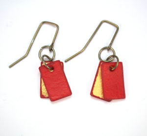 Open image in slideshow, lightweight hypoallergenic rectangle geometric metallic painted rawhide dangle earrings, handmade in Wyoming, ruby red and gold
