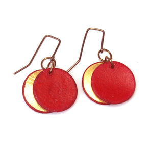 Open image in slideshow, lightweight hypoallergenic circle geometric metallic painted rawhide dangle earrings, handmade in Wyoming, ruby red and gold
